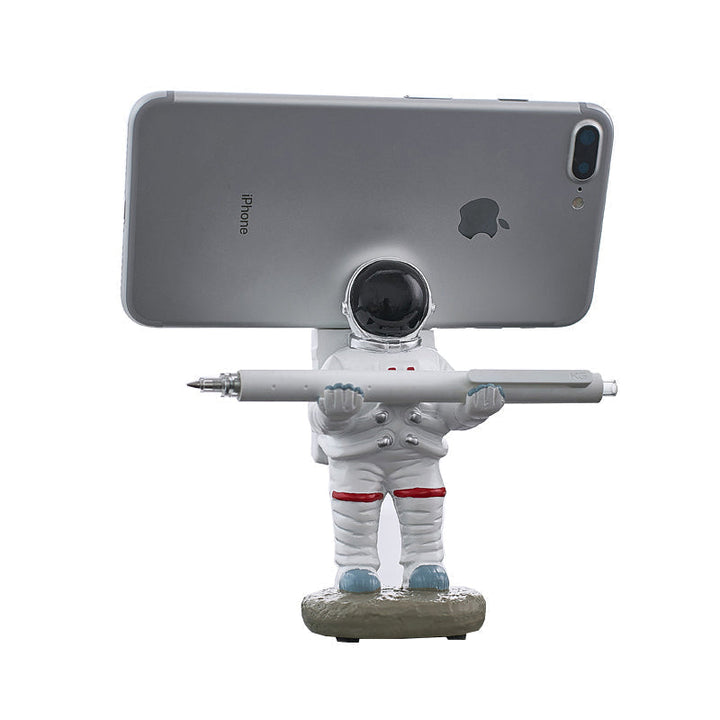 Støtte for mobiltelefon eller penn i astronautdekorasjoner | Luvikno