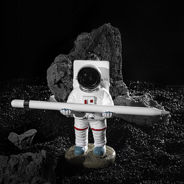 Støtte for mobiltelefon eller penn i astronautdekorasjoner | Luvikno