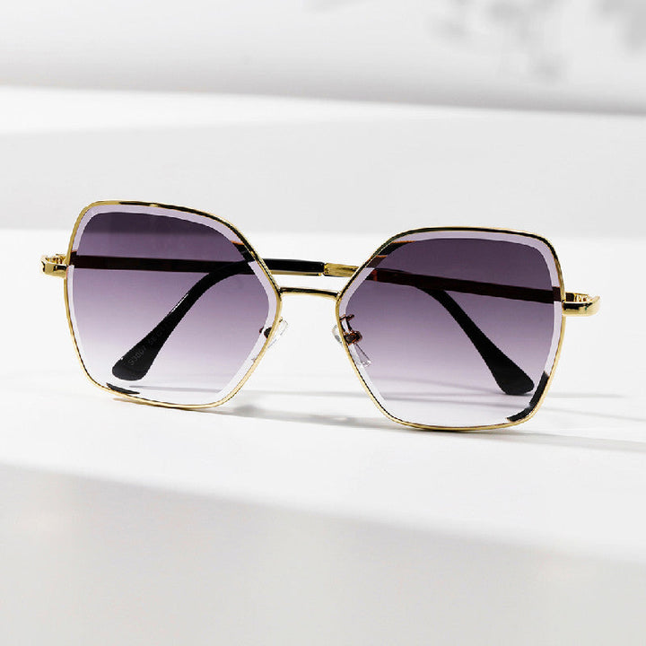 Dame geometrisk solbrille med fashionable gullramme Luvikno